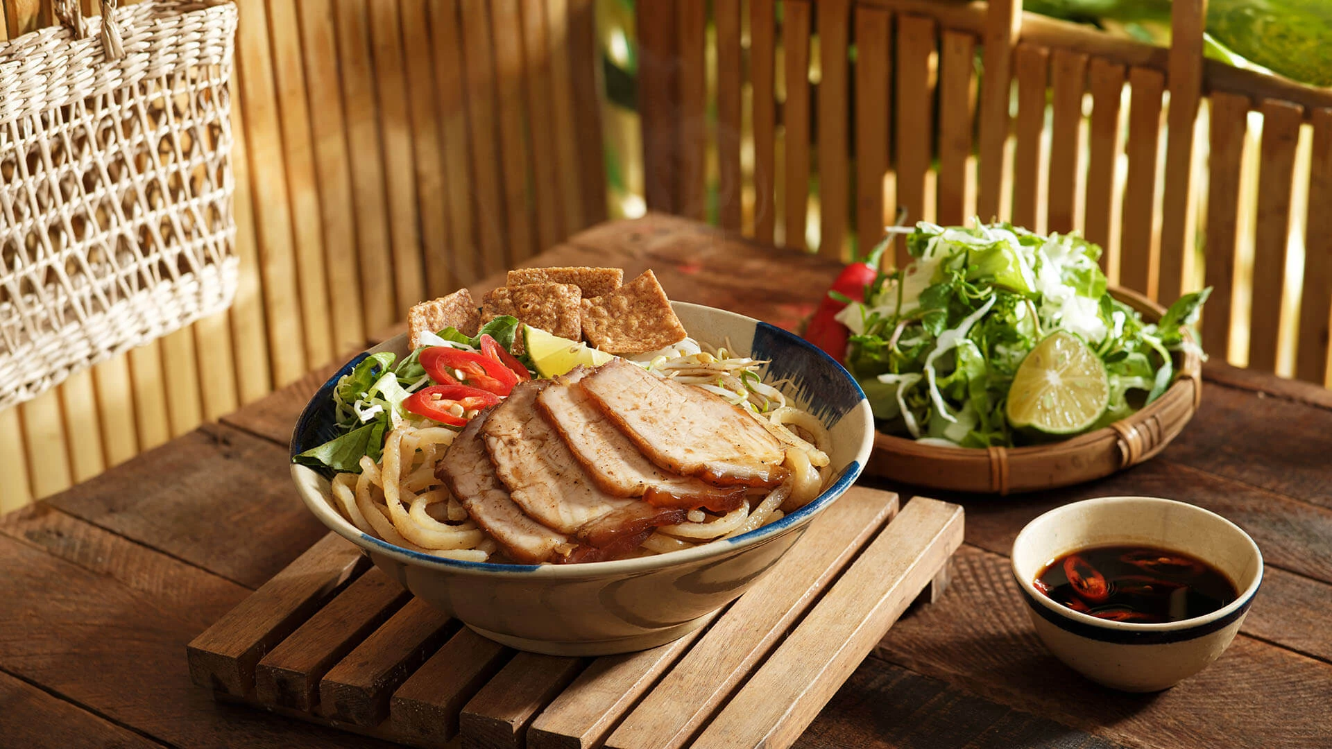 Tet in Hoi An: Wigo Tourist's 2025 Festive Guide 16 Cao Lau Hoi An (a traditional noodle specialty of Hoi An, Vietnam) - Danang Fantasticity - Da Nang City Tourism Information Portal